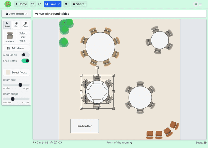 Room creator screenshot in Seating Chart Maker. A small wedding or event venue layout is being created with round tables and chairs. A table group with 6 chairs is selected for rotation or moving it. The room has decorative plants and a candy buffet table.